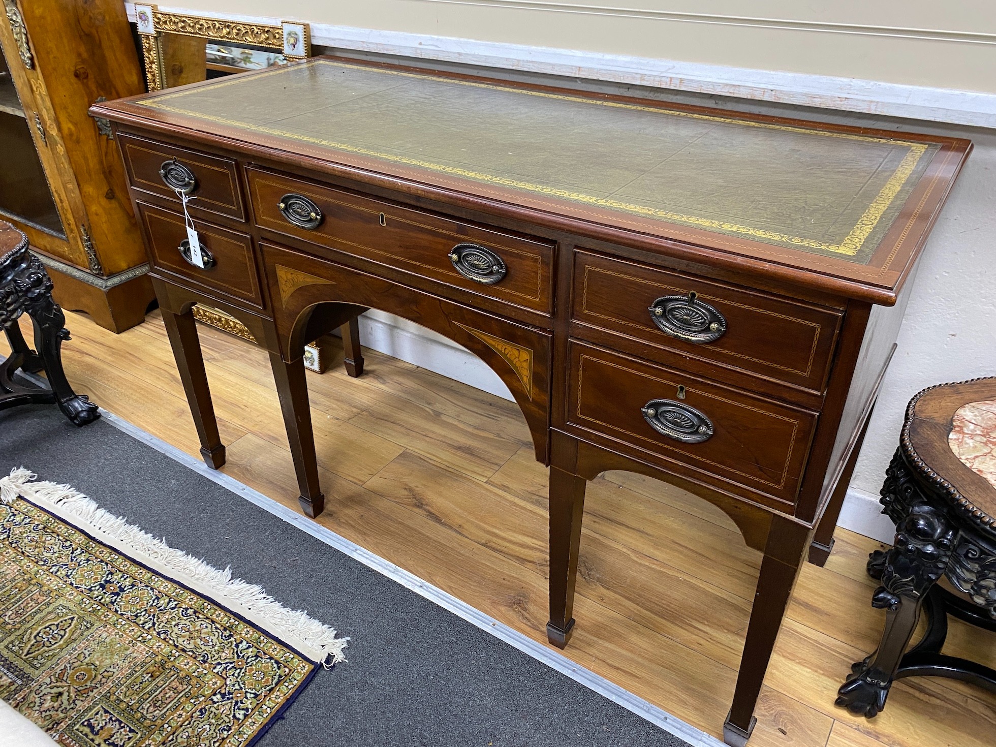 An Edwardian inlaid mahogany kneehole writing table, width 132cm, depth 56cm, height 81cm